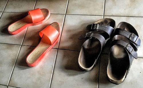 High angle view of shoes on tiled floor