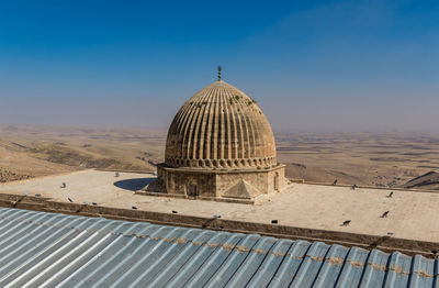 View of temple against clear blue sky