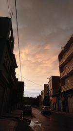 Low angle view of buildings against sky during sunset