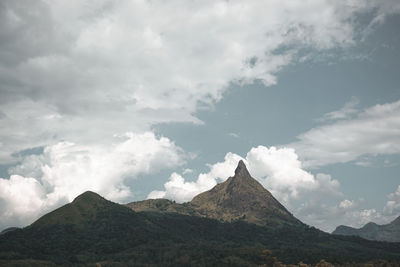 Low angle view of mountain range against sky