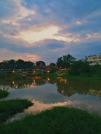 Scenic view of lake against sky at sunset