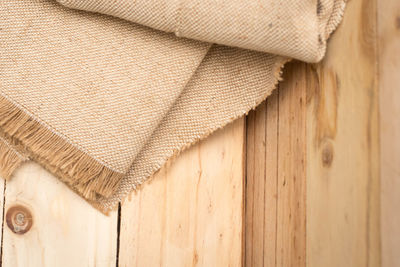 High angle view of burlap on wooden table