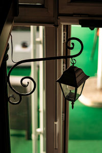 Close-up of lighting equipment hanging on window