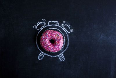 Directly above shot of strawberry on black background