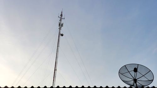 Low angle view of ferris wheel against sky