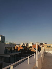 Buildings against clear blue sky