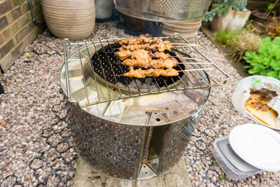 High angle view of meat on barbecue grill