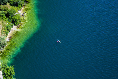 High angle view of sea against blue sky