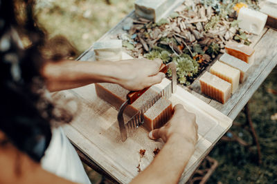 Making handmade natural soaps on an old wooden table