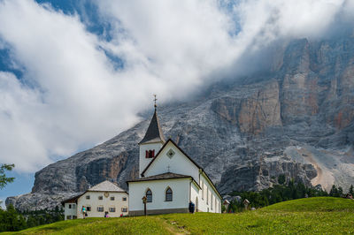 Panoramic view of building and mountains against sky