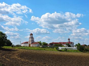 House on field against sky