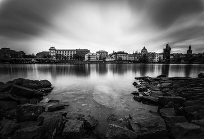 Panoramic view of lake and buildings against sky