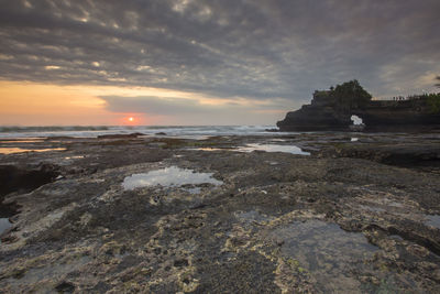 Scenic view of beach at sunset