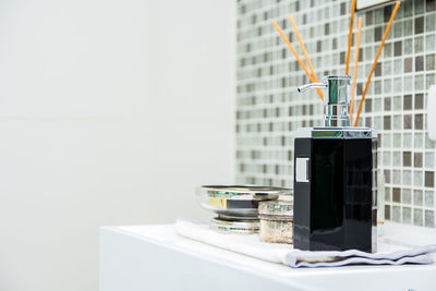 Luxury liquid soap bottle on the sink in modern bathroom