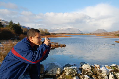 Tourist photographing outdoors