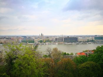 City at waterfront against sky