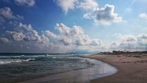 Scenic view of sea against cloudy sky