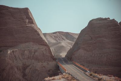 Panoramic view of mountain road against clear sky