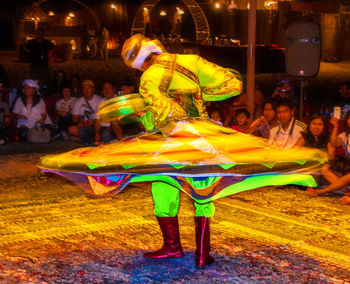 Group of people dancing at night