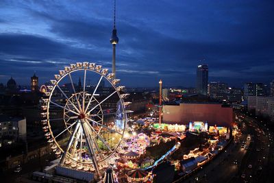 Illuminated ferris wheel at night