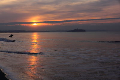 Scenic view of sunset over sea