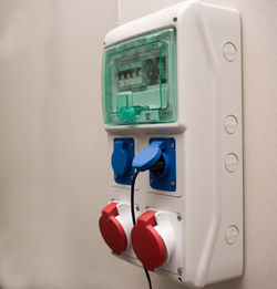 Close-up of telephone booth on wall