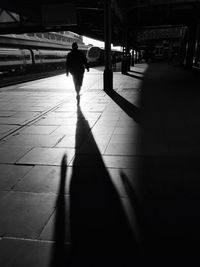 Shadow of people on road