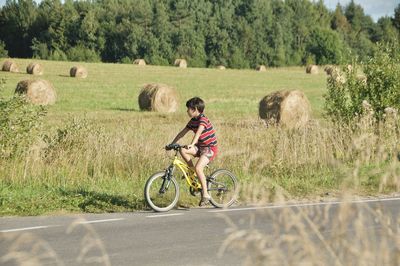 Man riding bicycle on road