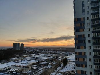 High angle view of buildings against sky during sunset