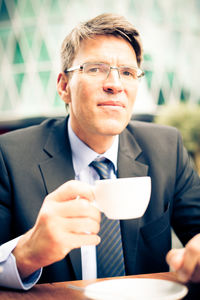 Portrait of man working on table
