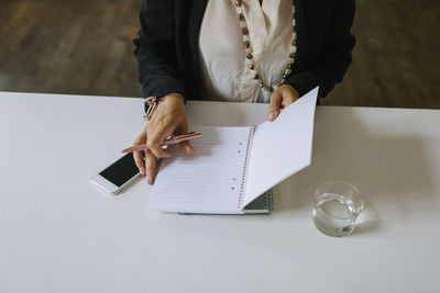 Womans hands with notebook