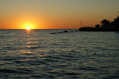 View of calm sea at sunset