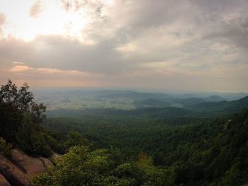 Scenic view of mountains against cloudy sky