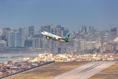 Aerial view of city buildings against sky