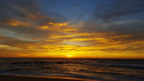 Scenic view of sea against dramatic sky