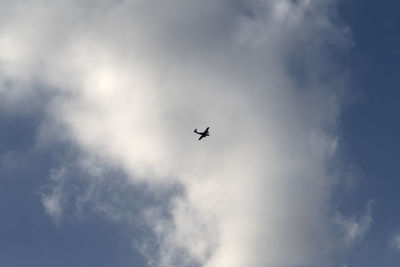 Low angle view of airplane in sky