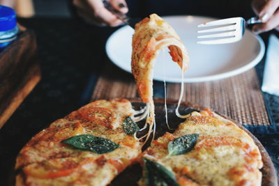 Close-up of pizza served on table