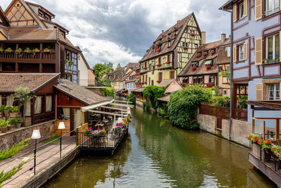 Canal amidst buildings in city