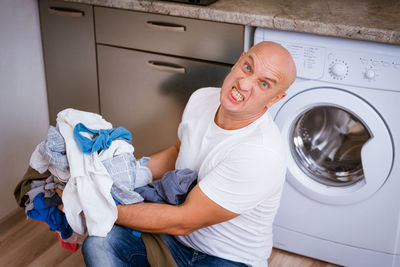 Midsection of man with text in machine