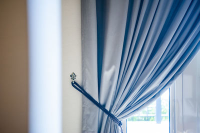 Curtain by window at home