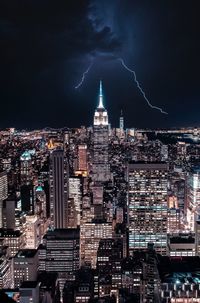 Illuminated buildings in city at night