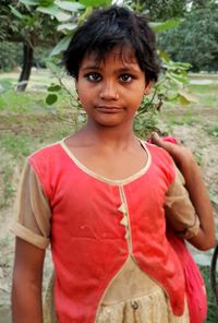 Portrait of woman standing outdoors