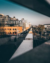 City street by buildings against sky