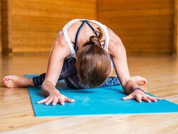 Woman doing yoga in studio