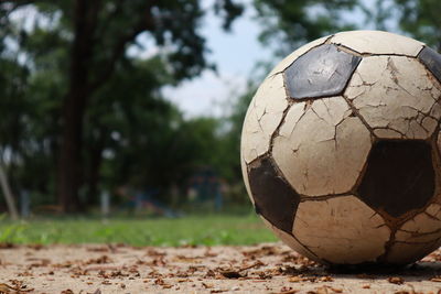 Close-up of soccer ball on field