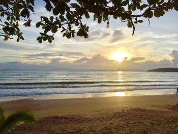 Scenic view of beach against sky during sunset