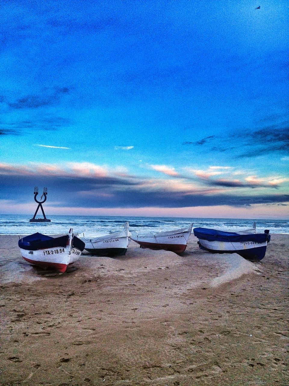 nautical vessel, sea, transportation, boat, water, mode of transport, beach, sky, moored, shore, horizon over water, sand, tranquility, tranquil scene, scenics, beauty in nature, cloud - sky, nature, sunset, cloud