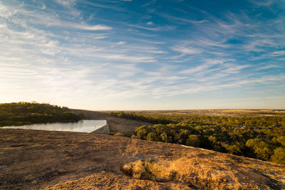 Scenic view of lake against sky during sunset