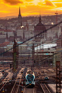 High angle view of buildings in city at sunset