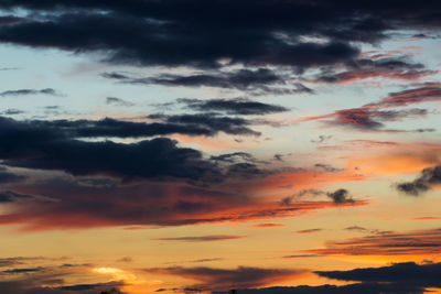 Low angle view of dramatic sky during sunset